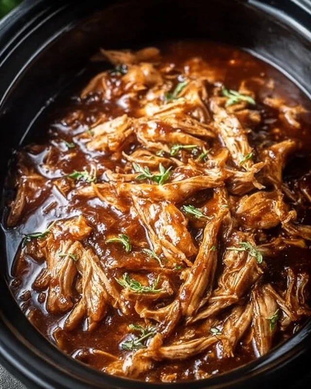 Crock Pot Bourbon Chicken with savory sauce served on a plate