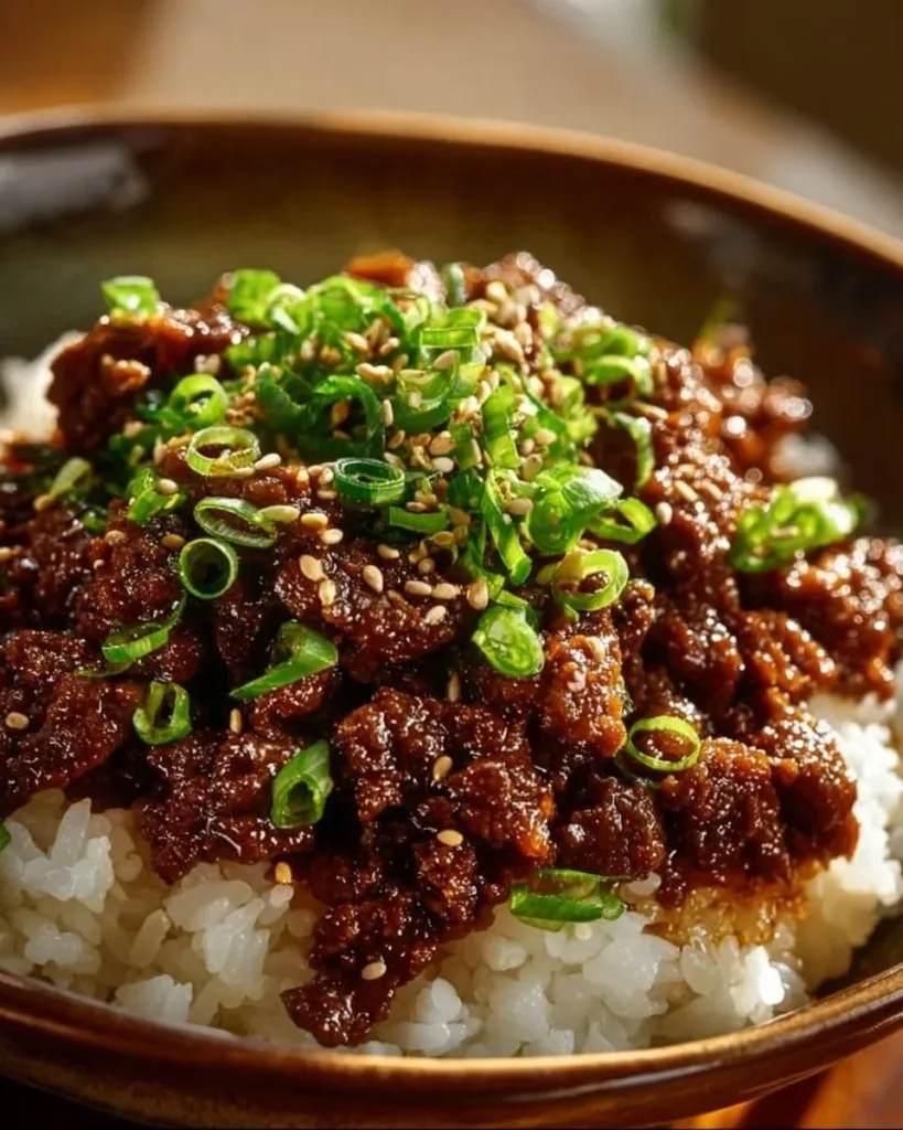 Korean Ground Beef Bowl garnished with veggies and sesame seeds
