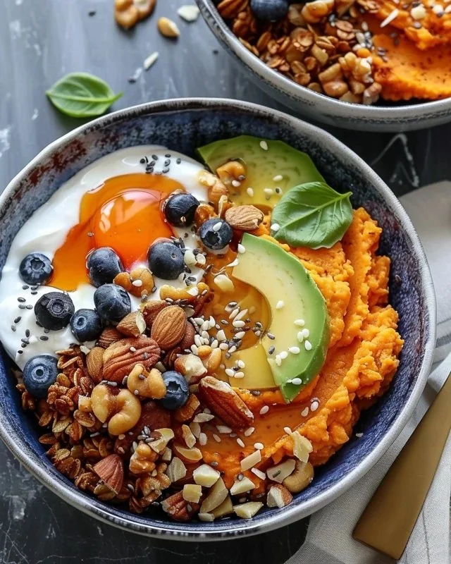 Colorful and nutritious sweet potato breakfast bowls topped with fruits and nuts.