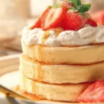 Fluffy Japanese soufflé pancakes stacked on a plate