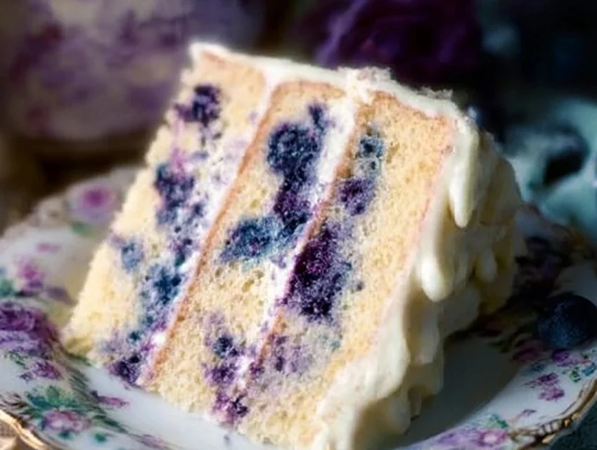 Lemon Blueberry Cake topped with fresh blueberries and lemon zest
