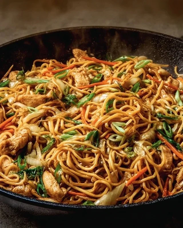 Delicious plate of quick chicken fried noodles garnished with vegetables